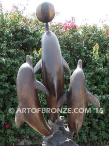 Game Play heroic bronze fine art gallery sculpture of leaping dolphins
