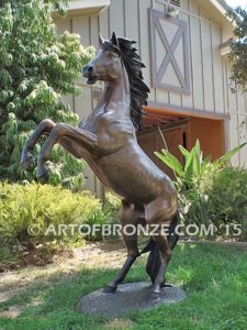 Thunderstorm sculpture of reared horse with forelegs off the ground and hind legs attached bronze base