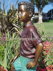 Soccer Star bronze sculpture of AYSO soccer player getting ready to play his game