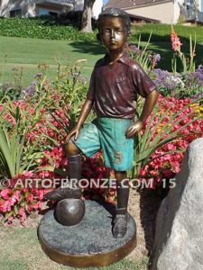 Soccer Star bronze sculpture of AYSO soccer player getting ready to play his game