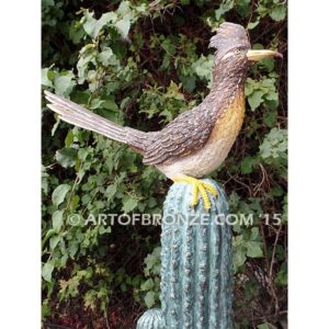 Desert Life (Roadrunner) life-size statue of a bronze cactus with a roadrunner on top of it