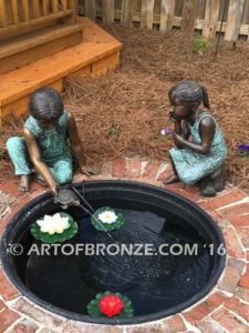 Cutie Pie bronze sculpture of sitting girl on knee daydreaming