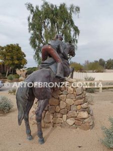 Show Jumper Olympic equestrian bronze horse and rider equestrian statue for Griffin Ranch in La Quinta, CA