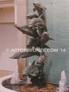 Dolphin Jubilation bronze Art in Public places monument of 9 nine leaping dolphins over 10 ft. tall