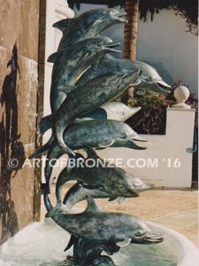 Dolphin Jubilation bronze Art in Public places monument of 9 nine leaping dolphins over 10 ft. tall