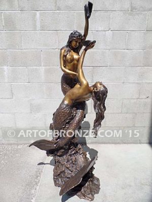 Bronze mermaid sculpture holding oyster shell for pond, pool or aquatic display