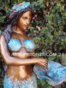 Bronze mermaid sculpture holding oyster shell for pond, pool or aquatic display