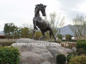 Striking Freedom bronze monument sculpture of assertive stallion horse for Griffin Ranch in La Quinta, CA