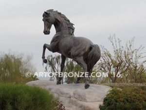 Striking Freedom bronze monument sculpture of assertive stallion horse for Griffin Ranch in La Quinta, CA