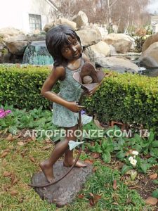 Summer Bloom bronze sculpture of girl holding sunflower