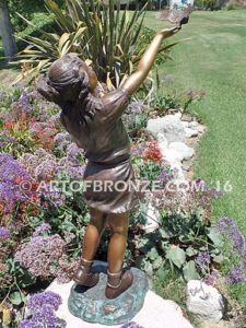 Faith and Hope bronze statue of young standing girl with doves in her hands