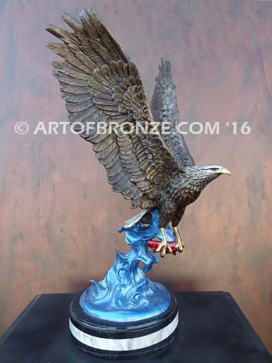 Bronze sculpture of flying eagle with captured salmon on custom marble base