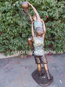 Takin it to the Hoop bronze sculpture of junior basketball players dunking