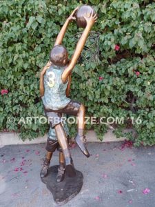 Takin it to the Hoop bronze sculpture of junior basketball players dunking