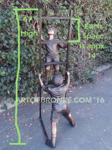 Team Work bronze sculpture of two boys climbing ladder working on house