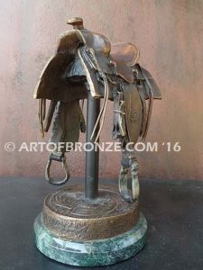 A Good Days Work bronze sculpture of western horse saddle attached to a marble base