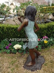 Summer Bloom bronze sculpture of girl holding sunflower