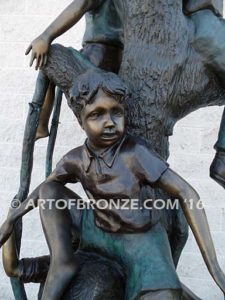 Kids in a tree bronze sculpture of kids climbing in tree for school park