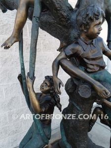 Kids in a tree bronze sculpture of kids climbing in tree for school park