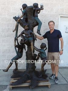 Kids in a tree bronze sculpture of kids climbing in tree for school park