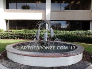 Round and Round bronze fine art gallery sculpture of dolphins, whales and porpoises