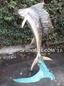 Heroic sculpture of bronze leaping sailfish that can spray water from bill into estate fountain