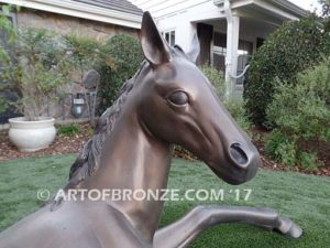 Spring Blessing bronze sculpture of laying foal, filly, colt and yearling horse for ranch or equestrian center