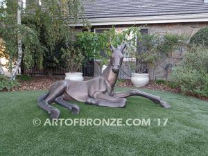 Spring Blessing bronze sculpture of laying foal, filly, colt and yearling horse for ranch or equestrian center