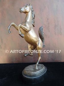 Legendary Spirit sculpture of reared horse on one leg attached to a marble base