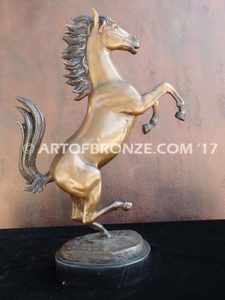 Legendary Spirit sculpture of reared horse on one leg attached to a marble base