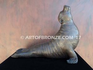 Sunbather bronze sea lion and seal mascot sculpture for zoo, university or school mascot