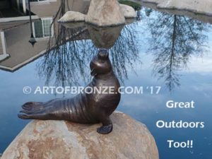 Sunbather bronze sea lion and seal mascot sculpture for zoo, university or school mascot