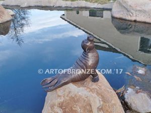 Sunbather bronze sea lion and seal mascot sculpture for zoo, university or school mascot