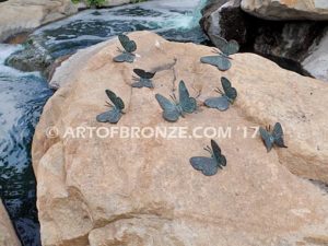 Butterfly Migration statue of rock with butterflies on it