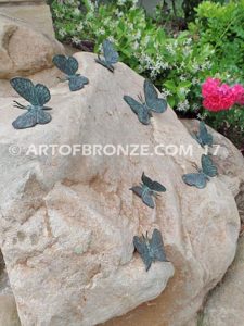 Butterfly Migration statue of rock with butterflies on it