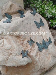 Butterfly Migration statue of rock with butterflies on it