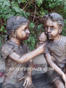 Special Scoop bronze sculpture of girl sharing her ice cream treat with her brother