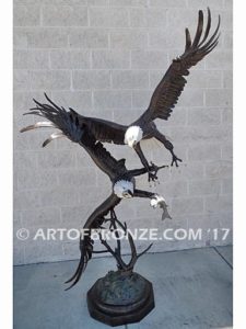 Fish Thieves bronze sculpture of monumental eagles fighting over captured salmon