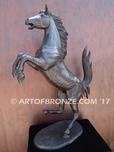 Legendary Spirit sculpture of reared horse on one leg attached to a marble base