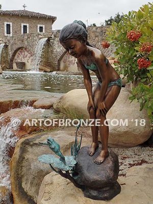 Pond Fun bronze sculpture of young girl in bathing suit playing with bullfrog