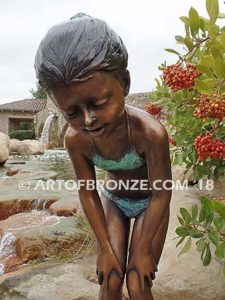 Pond Fun bronze sculpture of young girl in bathing suit playing with bullfrog