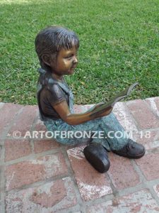 Book Smart other side bronze sculpture of young sitting girl with book