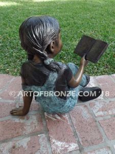 Book Smart back view B bronze sculpture of young sitting girl holding book