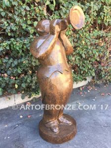 Stylized trumpet player outdoor modern bronze statue