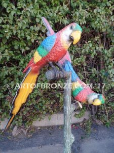 Double Talk statue of two macaws on a branch together