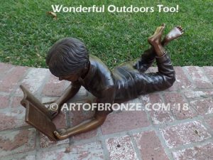 Best in His Class SV bronze sculpture of young boy reading his favorite novel