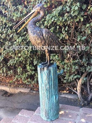 Along the Shore (I) bronze sculpture of life-size wild heron.