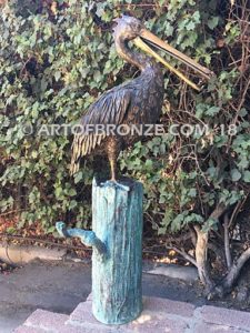 Along the Shore (I) bronze sculpture of life-size wild heron.