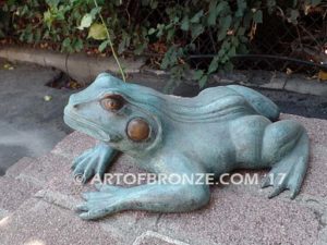 Bronze sculpture of resting frog for outdoor pond, pool or aquatic display