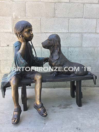 Future Vet bronze sculpture of veterinarian boy with stethoscope and dog on bench